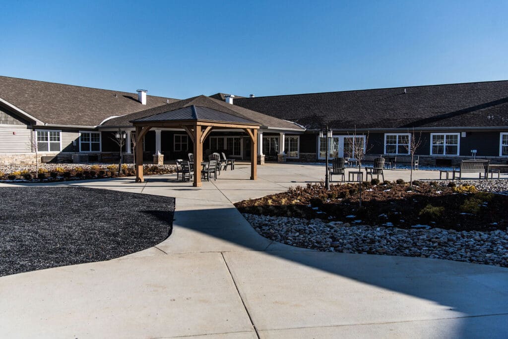 Spacious courtyard featuring a gazebo and patio furniture at Charter Senior Living of White House, TN.